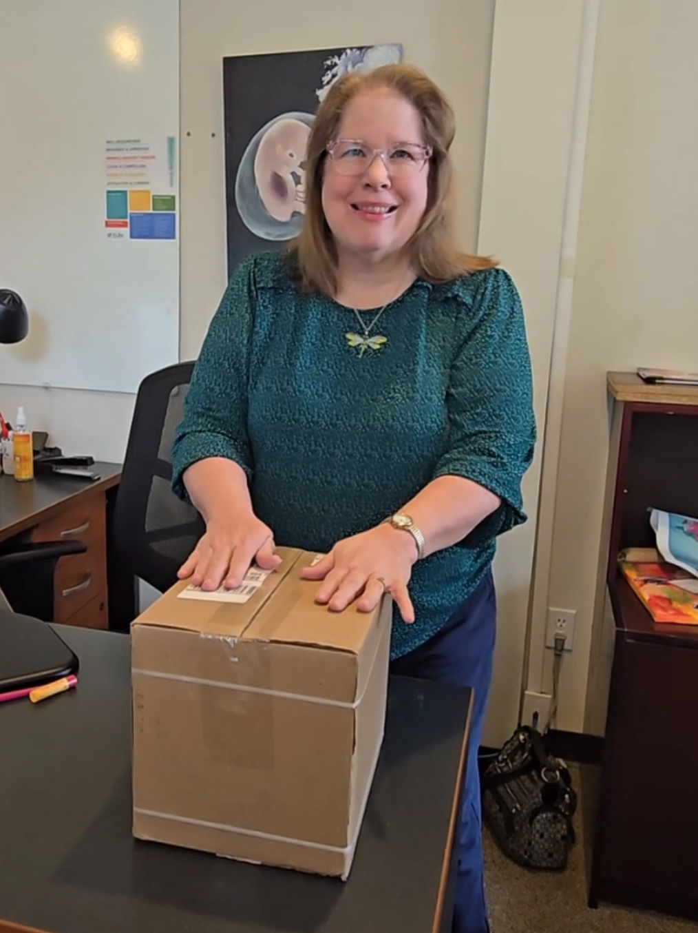 Debbie Unboxing the New Understanding Birth book + web app