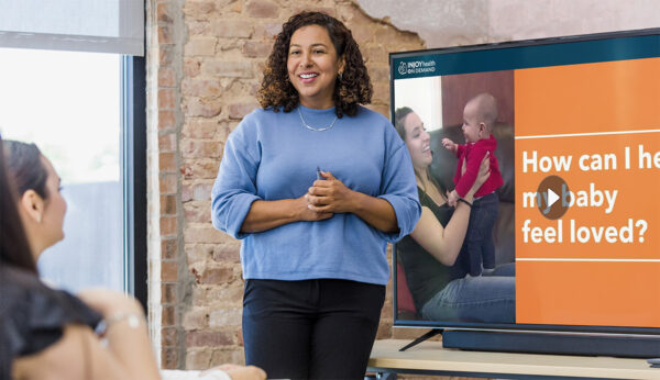 Parenting class educator presenting parenting videos using InJoy's Parenting Video Library