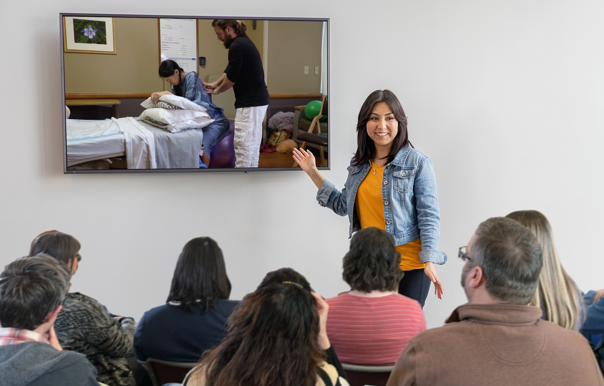 An independent childbirth educator using the Natural Birth & Beyond Video Library to show her childbirth class parents a video of labor pain management.